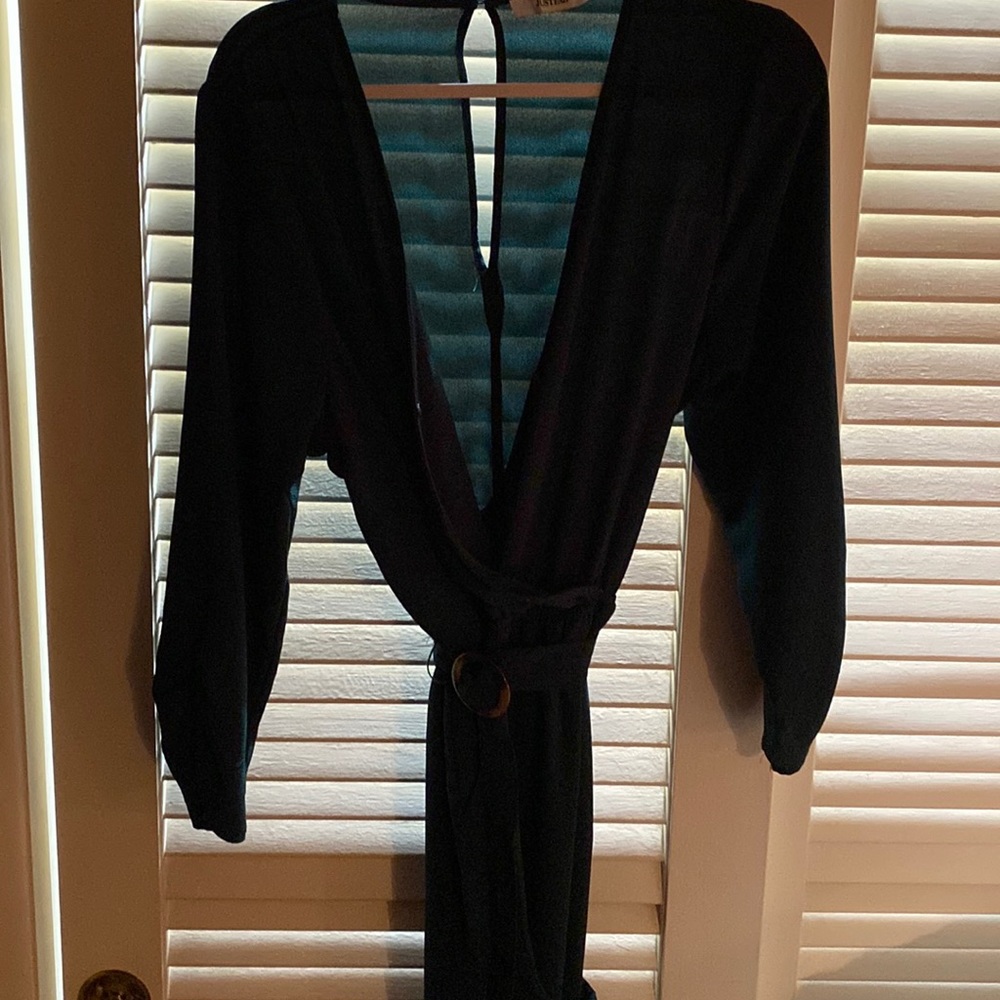 A dark green jumpsuit, never worn, in great condition. Ex large but runs small
